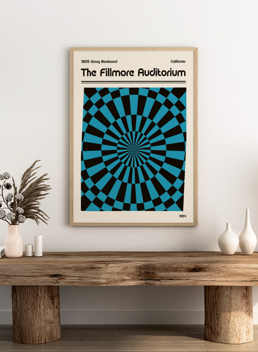 A poster-style graphic for The Fillmore Auditorium, with black text on a cream background and a large central optical illusion pattern in turquoise blue and black radiating inward. Text at the top reads &