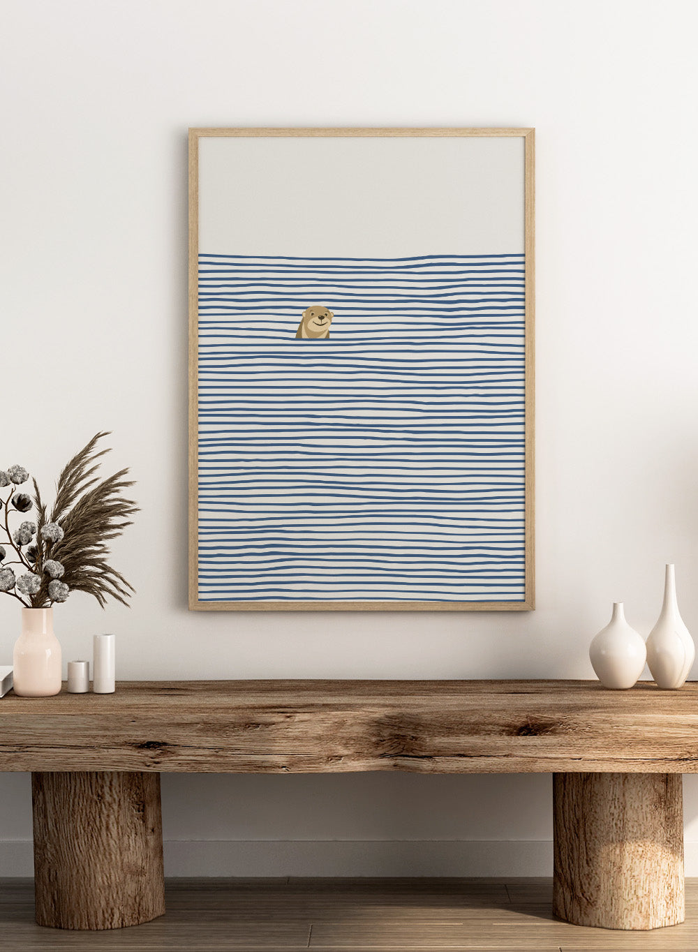 Otter in the Waves art print by Little Dean. Playful contemporary wall art featuring a smiling otter, blue wave pattern, minimalist illustration, and modern poster design.