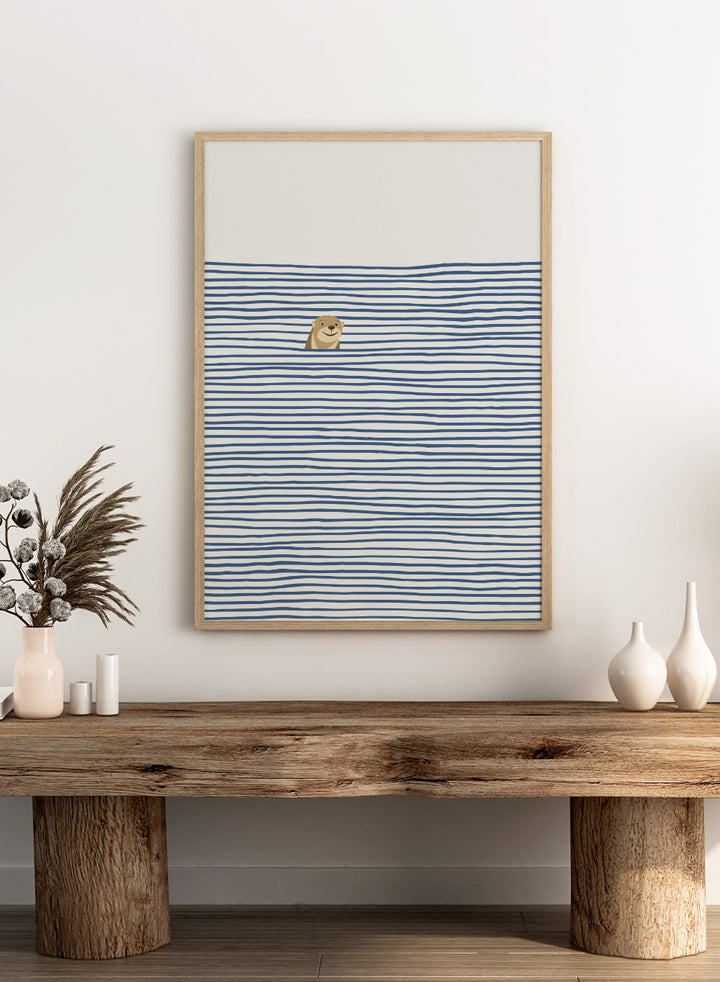 Otter in the Waves art print by Little Dean. Playful contemporary wall art featuring a smiling otter, blue wave pattern, minimalist illustration, and modern poster design.