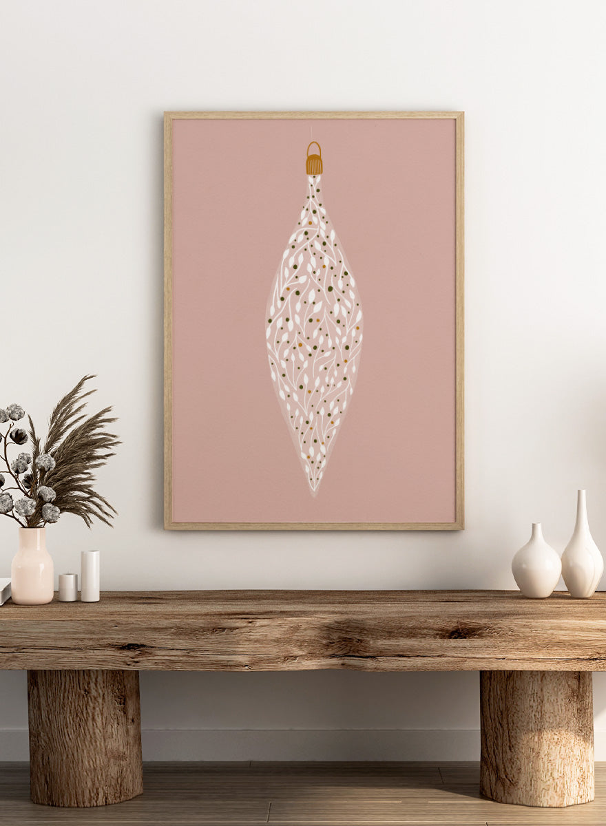 Shop Ornament On Pink by Katie O’Shea, a botanical Christmas wall art print poster featuring white leafy branches, green and gold details, and a dusty pink background.