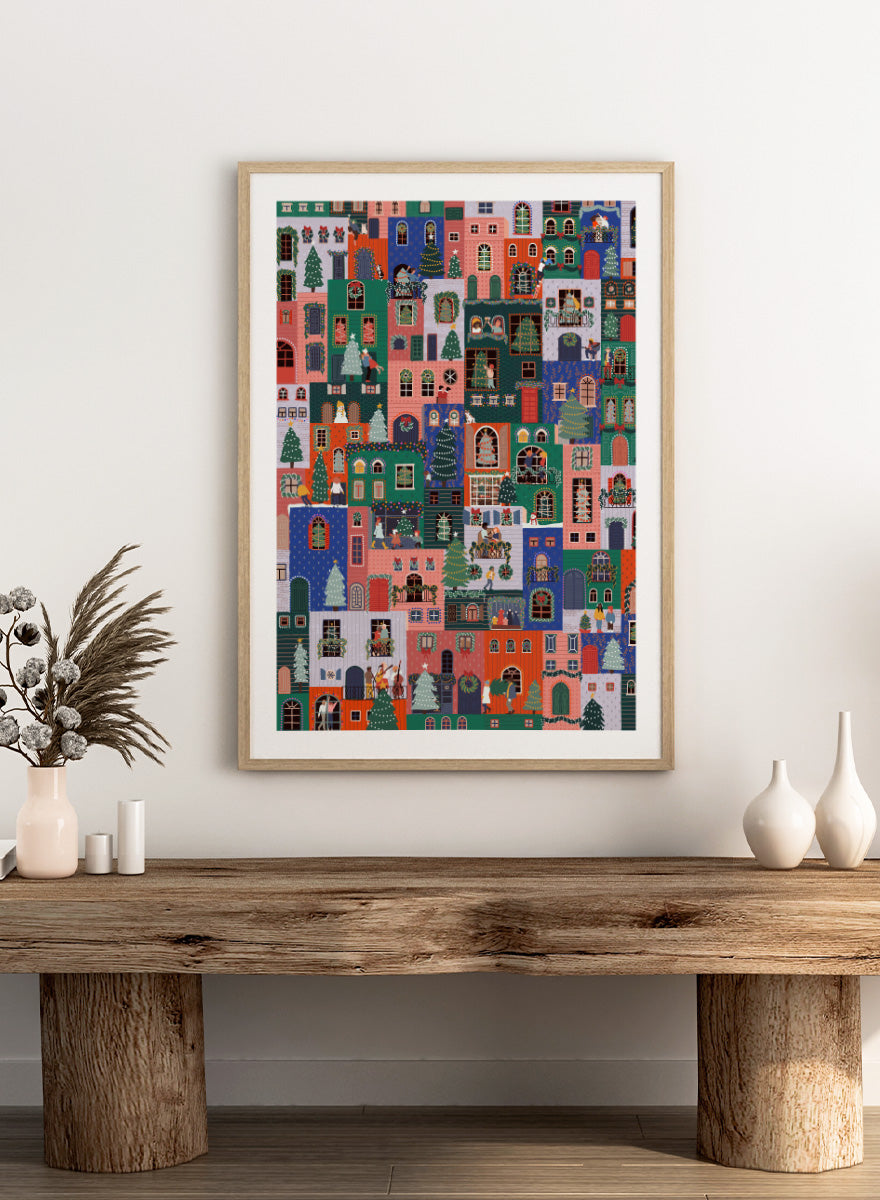 Shop Festive Christmas Town by Ceyda Alasar, a colorful Christmas wall art print poster featuring a lively holiday town filled with decorated homes and festive scenes.