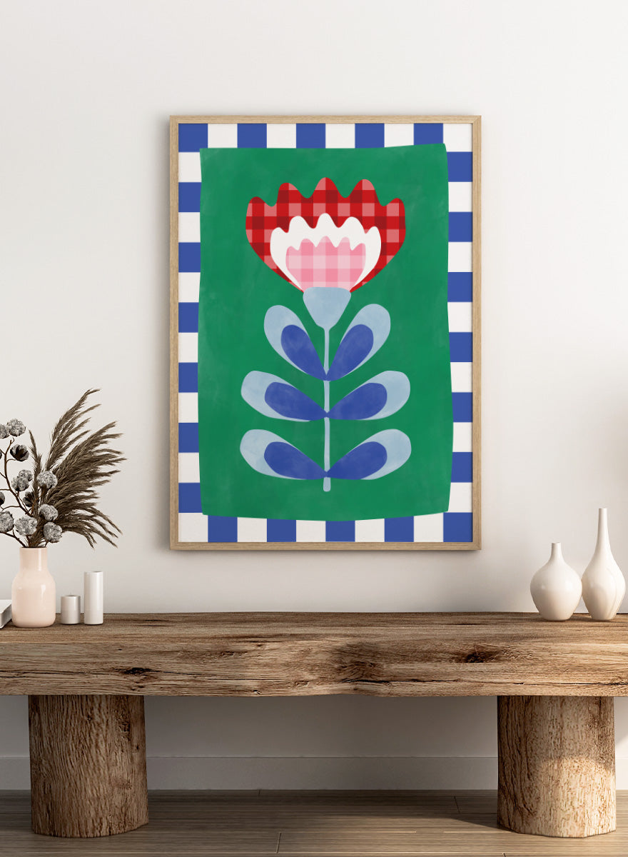 Shop Gingham Folk Flower by Elena Ristova, a colorful floral wall art print poster featuring gingham petals, checkerboard borders, and bold green, red, blue, and pink.