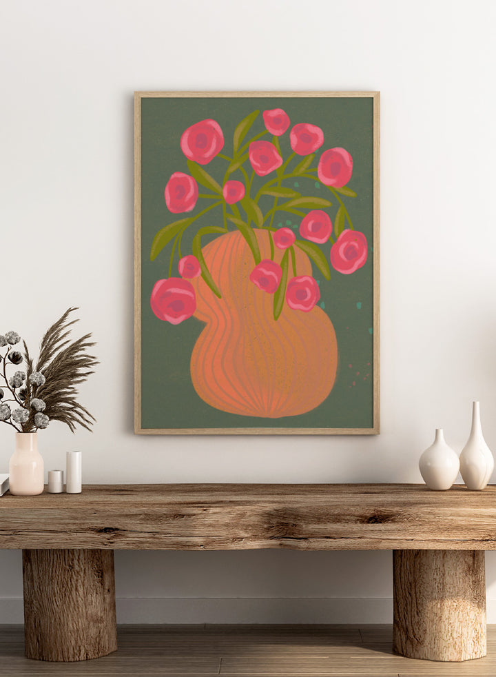 Shop Pink Flowers Orange Vase by Nikita Jariwala, a floral wall art print poster with bold pink blooms, an orange vase, olive stems, and deep green tones.