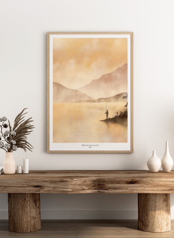 A framed art print featuring a serene landscape painting of a fisherman casting a line on a misty lake with mountains in the background, rendered in warm golden and beige tones. Shop Misty Lake Fisherman by Jake Waldron, a minimalist fishing wall art print featuring a lone angler, mountain lake, golden mist, and outdoor adventure.