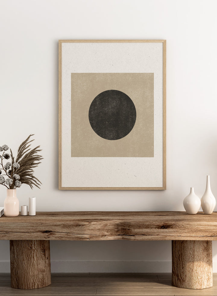 Black circle on beige background. Eclipse Silence by The MIUUS Studio is a minimalist abstract art print and wall poster featuring geometric shapes, neutral tones, and modern textured design.