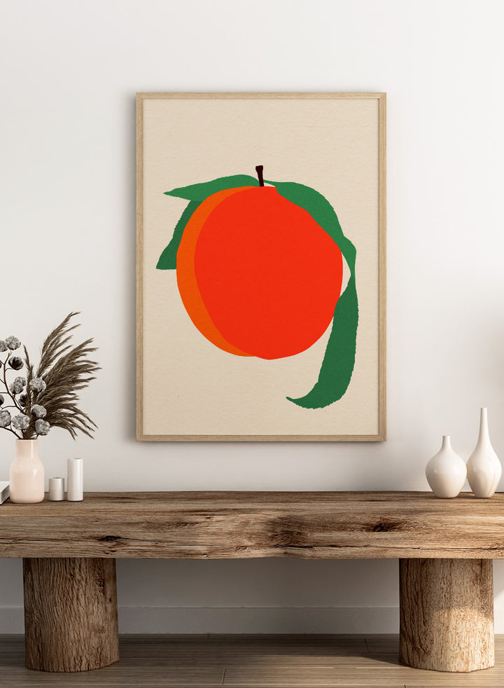 Illustration of a peach with green leaves on a beige background. Peach by Rosi Feist is a modern minimalist fruit art print with bold color and Bauhaus-inspired graphic design. Officially licensed fine art poster with framing.