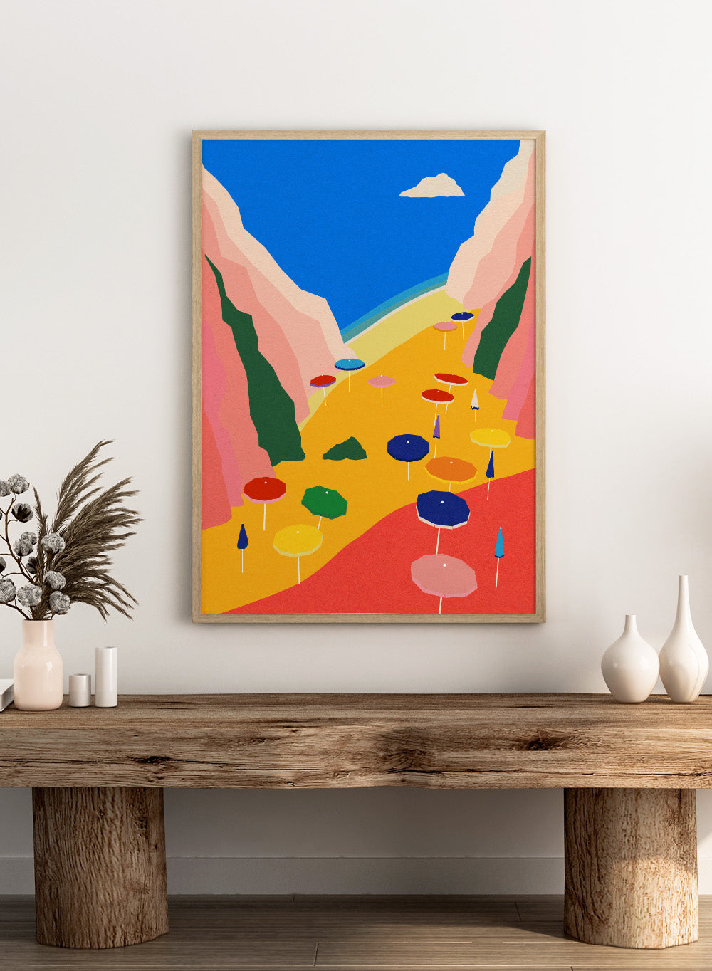 Colorful umbrellas on a red and yellow landscape with mountains and blue sky. Lido Liguria by Rosi Feist is a modern coastal art print with bold Mediterranean color, beach umbrellas, and minimalist Italian travel poster style.