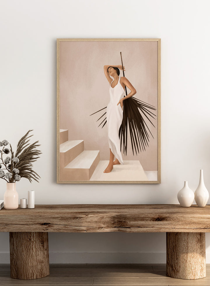 Woman in a white dress standing on a staircase with a palm leaf design. Elegant Tropical Serenity by City Art features a woman in a flowing white dress and palm leaves, bringing organic living, tropical style, and warm neutral tones into the home.