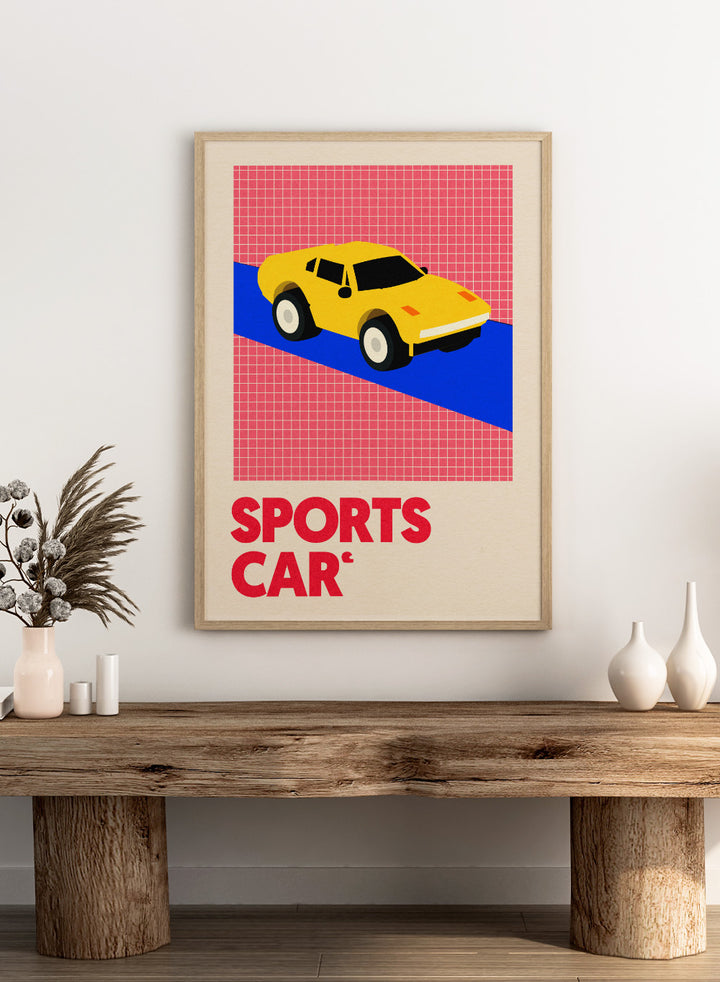 Yellow sports car on a red and blue geometric background with 'SPORTS CAR' text. Sports Car by Rosi Feist is a bold minimalist car art print featuring a bright yellow sports car and graphic typography. Officially licensed Bauhaus-inspired fine art poster with framing.
