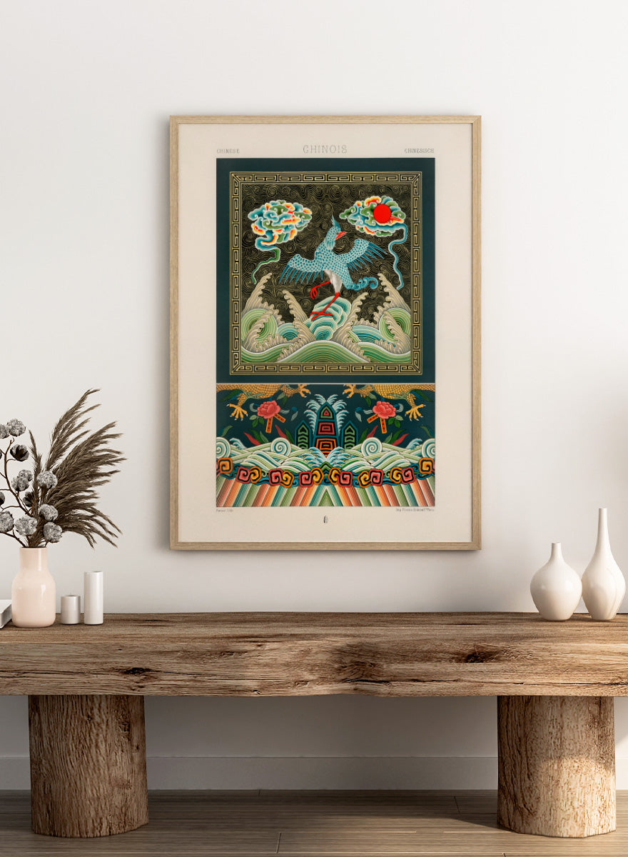 A framed art print featuring a traditional Chinese illustration with a blue bird, waves, clouds, and a red sun. Chinese Pattern by Albert Racinet vintage art print from an 1888 edition of L’Ornement Polychrome, featuring a crane, waves and colorful Chinese ornament.