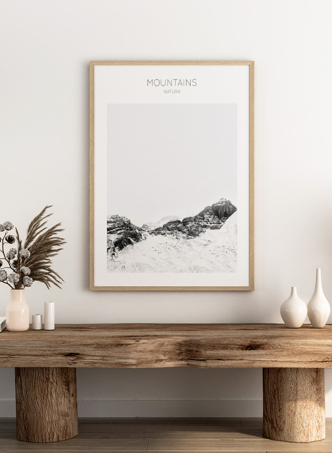 Black and white mountain landscape with 'Mountains Natura' text. Serene Peaks by The MIUUS Studio is a black and white mountain photography art print and wall poster featuring snowy peaks, minimalist composition, and modern neutral design.