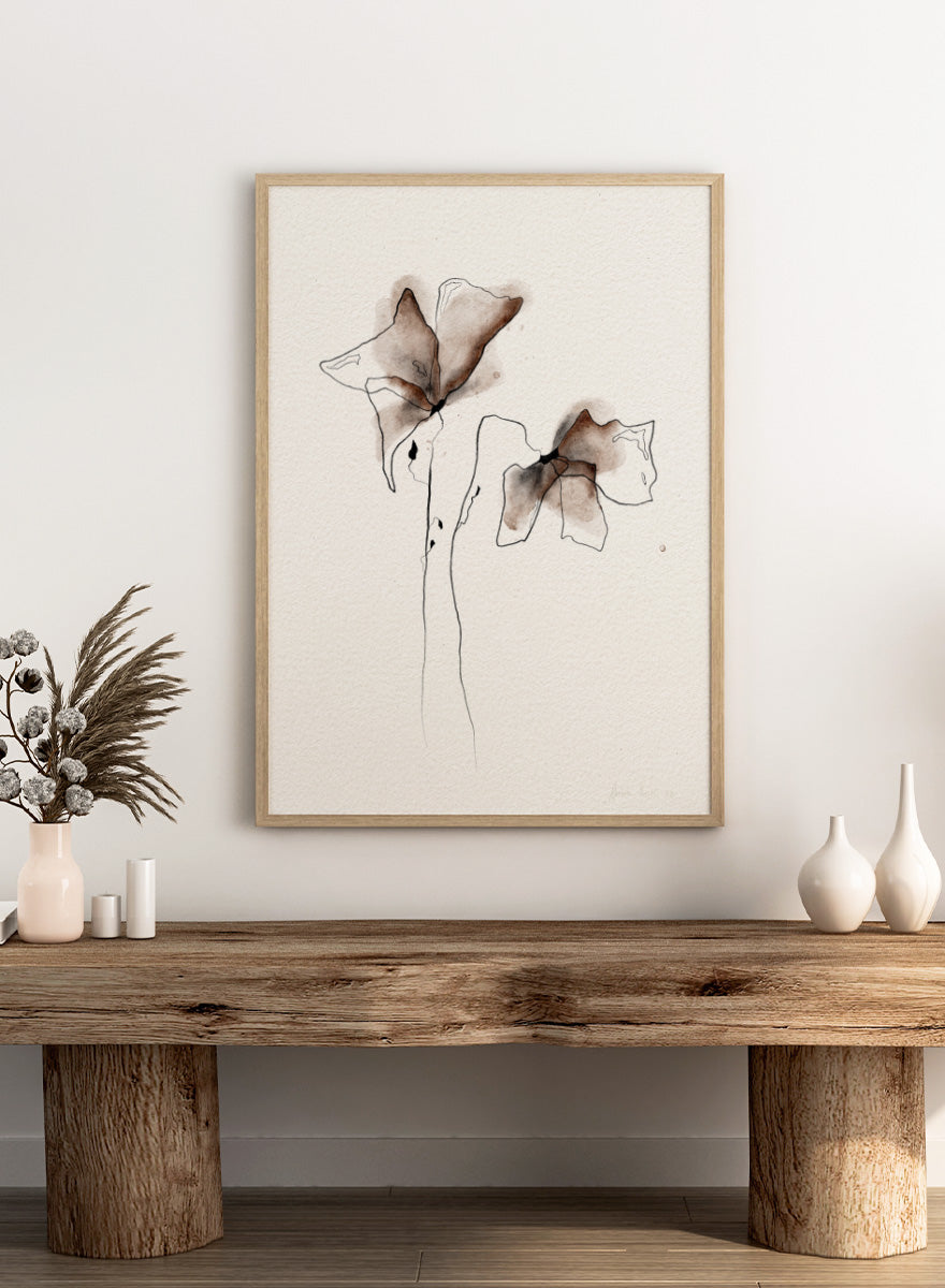 Minimalist watercolor and ink floral art print featuring two abstract flower shapes in brown and black tones on textured off-white paper. Shop Watercolor Botanical Blooms by Ankie Kooi, a modern floral wall art print poster with abstract botanical flowers, minimalist line art, brown, cream, and black.