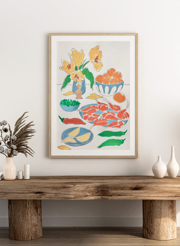 A framed still life art print featuring yellow tulips in a blue vase, bowls of oranges, red shrimp, green peppers, and yellow lemon wedges. Shop Fresh Flowers and Feast by Rushati Chowdhury, a colorful food and floral art print featuring shrimp, oranges, peppers, greens, lemon, and yellow flowers.