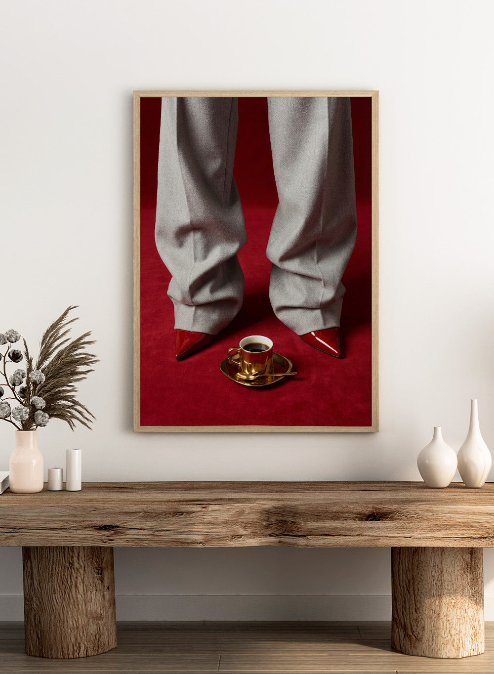 White pants with red shoes on a red carpet, featuring a gold cup and saucer with coffee. Red Shoes and Coffee by Andreas Magnusson is a fashion photography art print featuring red heels and espresso. Officially licensed modern wall poster.