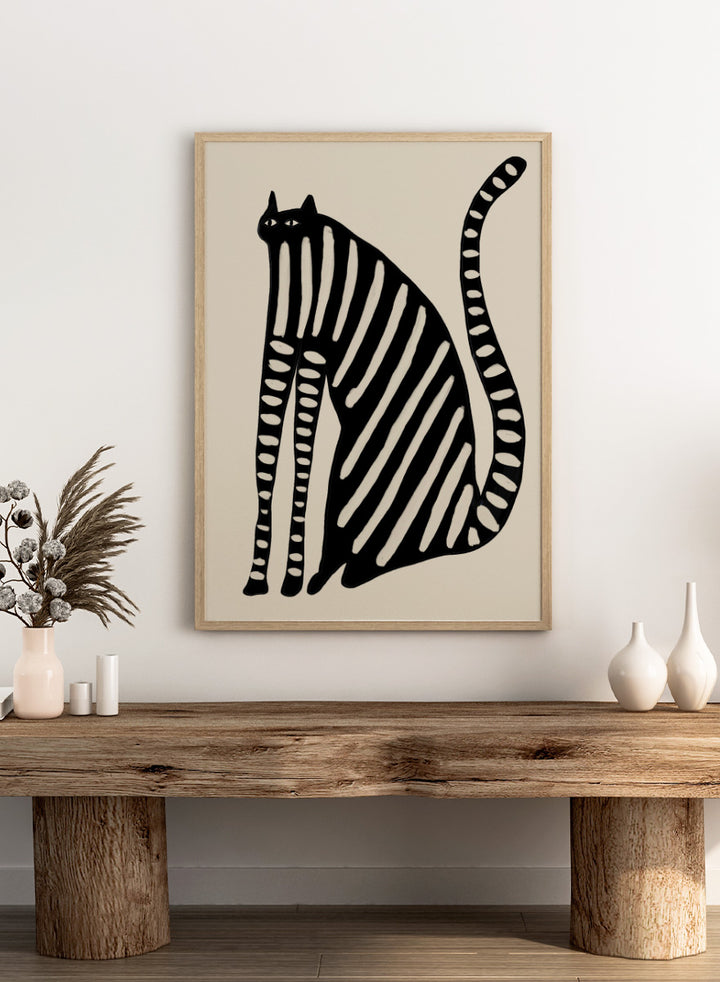 Striped Black Cat by The Art Concept playful cat art print featuring an elongated black cat with cream stripes, long legs, and an oversized curved tail.
