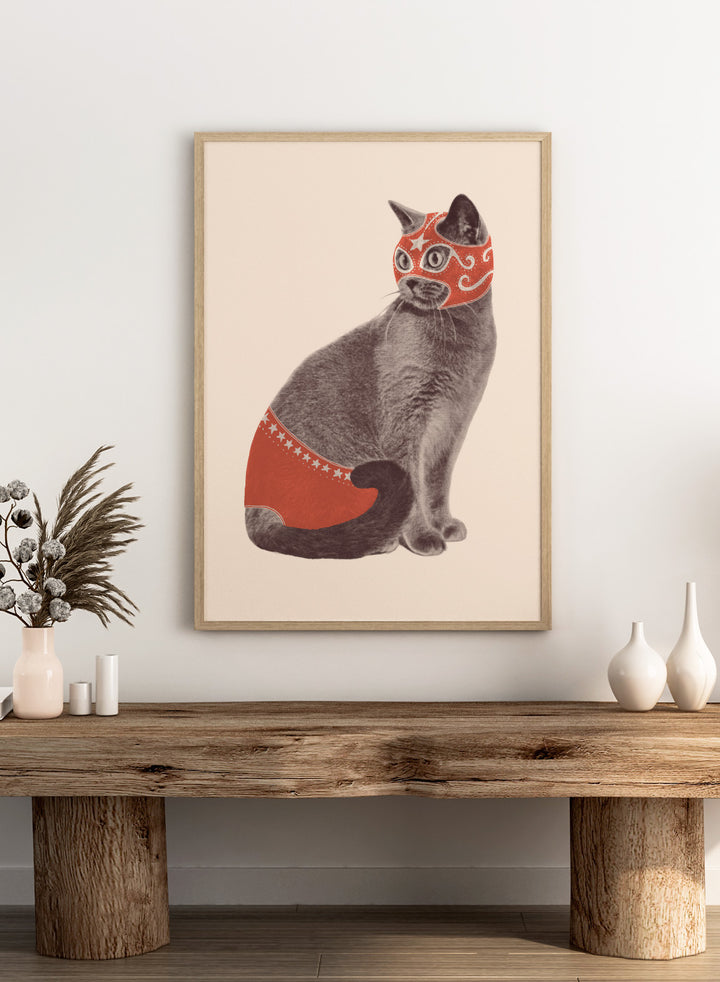 Cat wearing a red mask and underwear on a beige background. Funny Luchador Cat by Florent Bodart is a playful cat art print with bold red mask, a modern wall poster with humorous and surreal animal design.