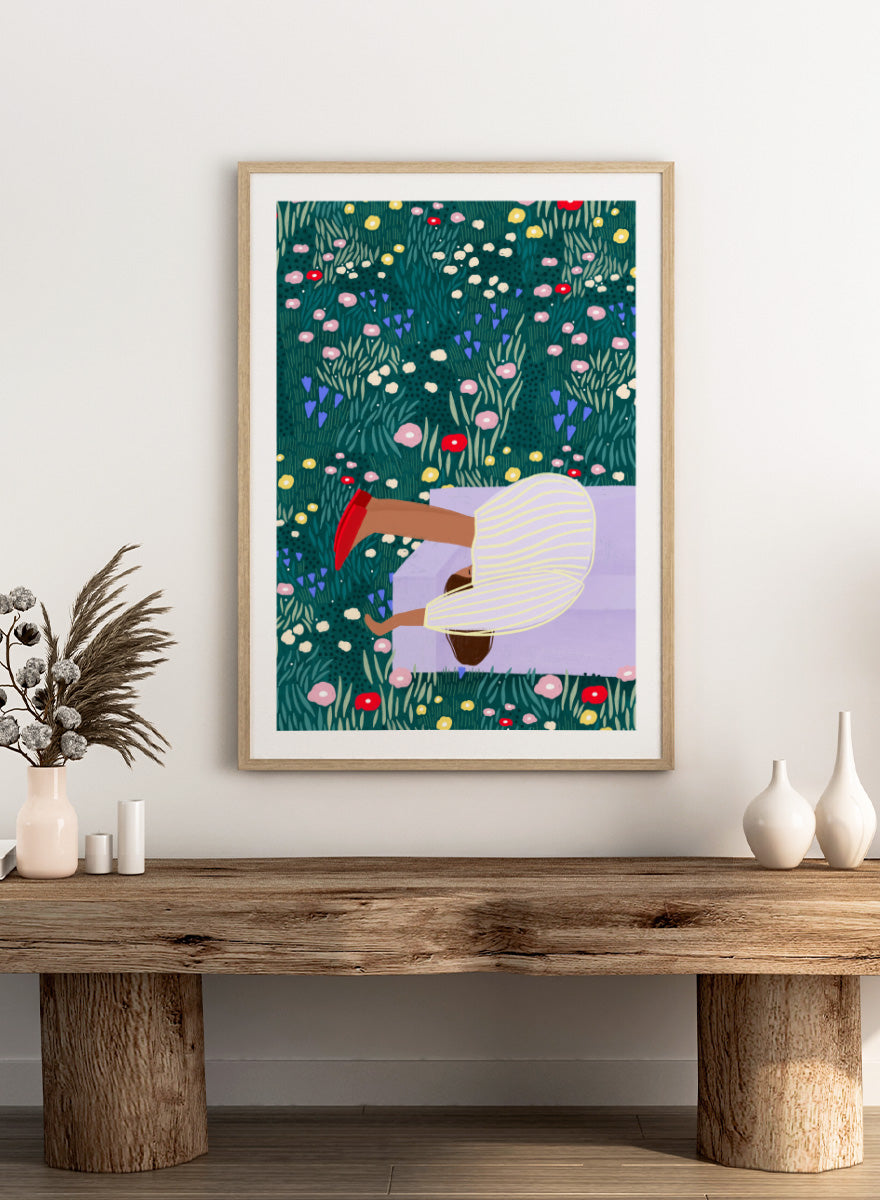 Shop Lush Garden Dreams by Bea Müller, a figurative floral wall art print poster featuring a woman reclining among colorful flowers and lush green garden foliage.
