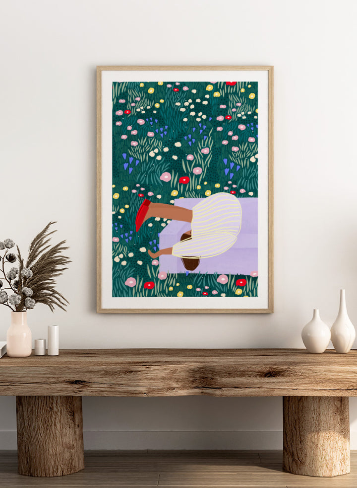 Shop Lush Garden Dreams by Bea Müller, a figurative floral wall art print poster featuring a woman reclining among colorful flowers and lush green garden foliage.