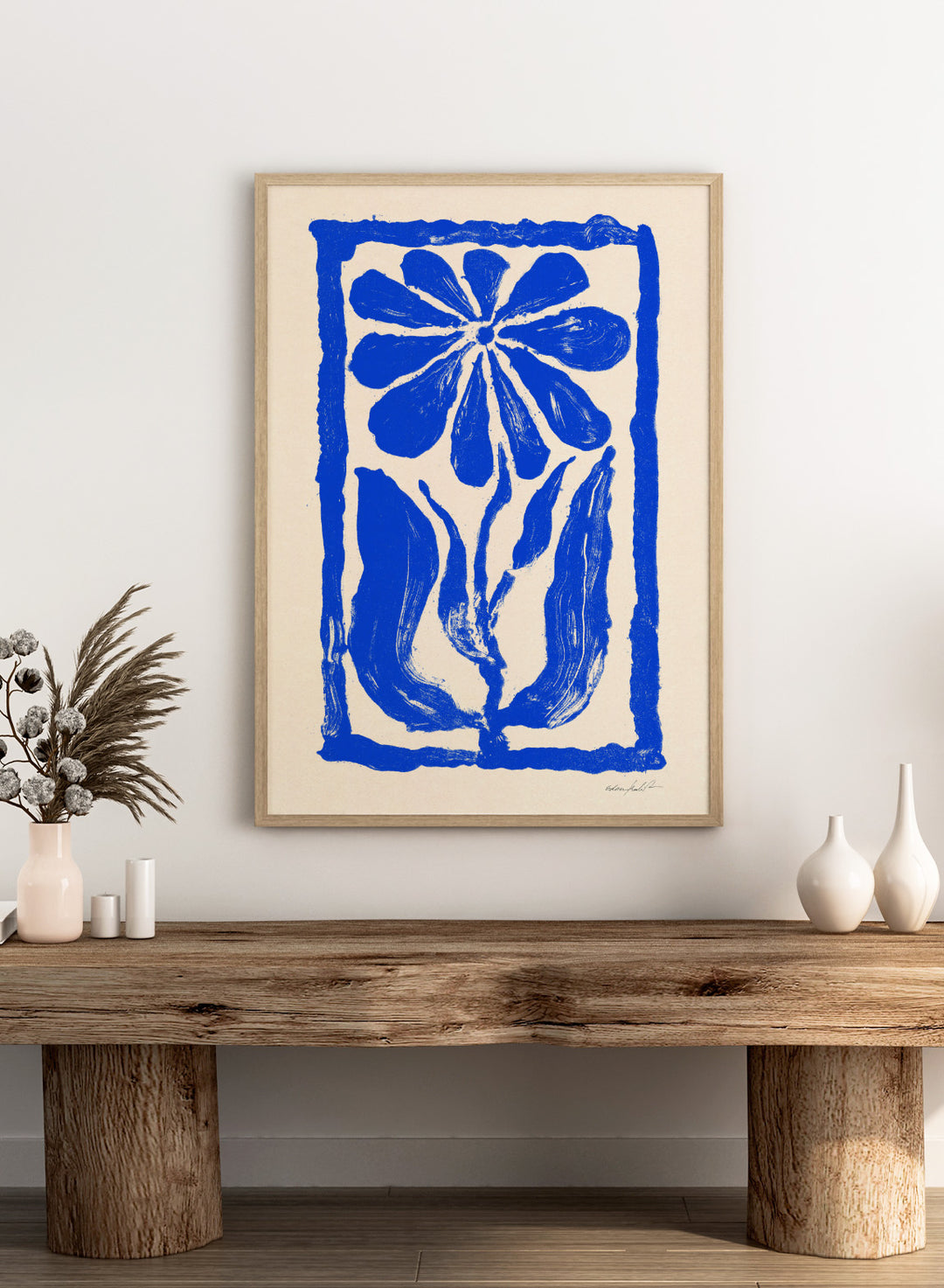 Blue floral design on a beige background. Blue Bloom by Eden Kalif is a modern floral art print featuring bold blue flower forms and graphic composition in a contemporary wall poster design.