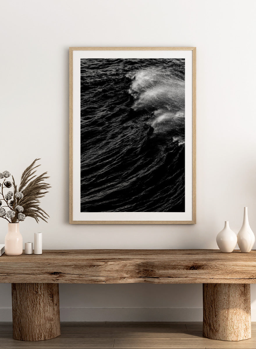 Black and white fine art photographic print of a crashing ocean wave. Dark Wave Symphony by Shot by Clint black-and-white ocean photography print featuring breaking waves, sea spray, and dramatic water texture.