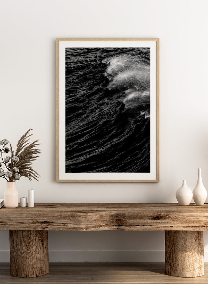Black and white fine art photographic print of a crashing ocean wave. Dark Wave Symphony by Shot by Clint black-and-white ocean photography print featuring breaking waves, sea spray, and dramatic water texture.