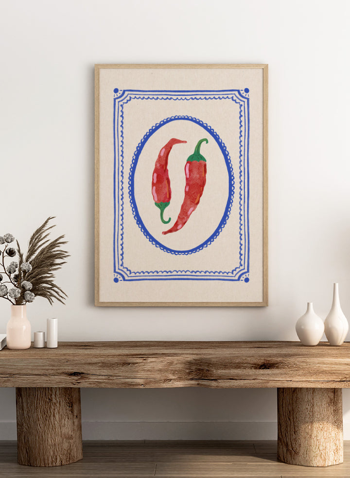Spicy Chili Peppers by Katarzyna Gąsiorowska kitchen art print featuring red chilies in an ornate cobalt frame with vintage Mediterranean style.