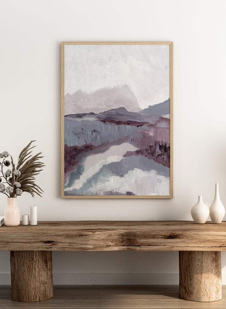 Shop Muted Mountain Landscape by Nikita Jariwala, an abstract mountain wall art print poster featuring misty peaks, layered scenery, and soft purple tones.
