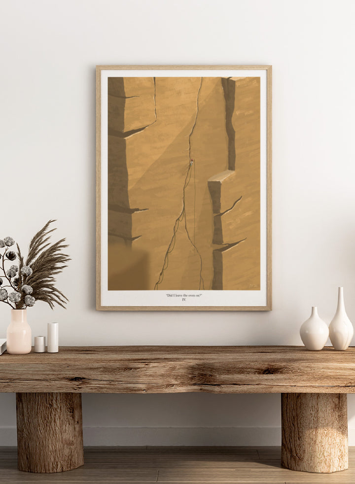 An art print featuring a minimalist illustration of a climber on a massive sandstone cliff, with the caption &