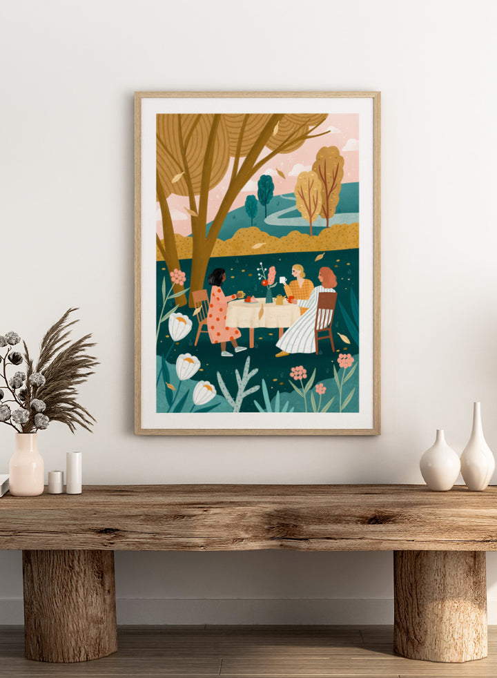 Shop Autumn Tea Party by Bea Müller, a figurative wall art print poster featuring three friends sharing tea in a garden surrounded by warm green autumn scenery.