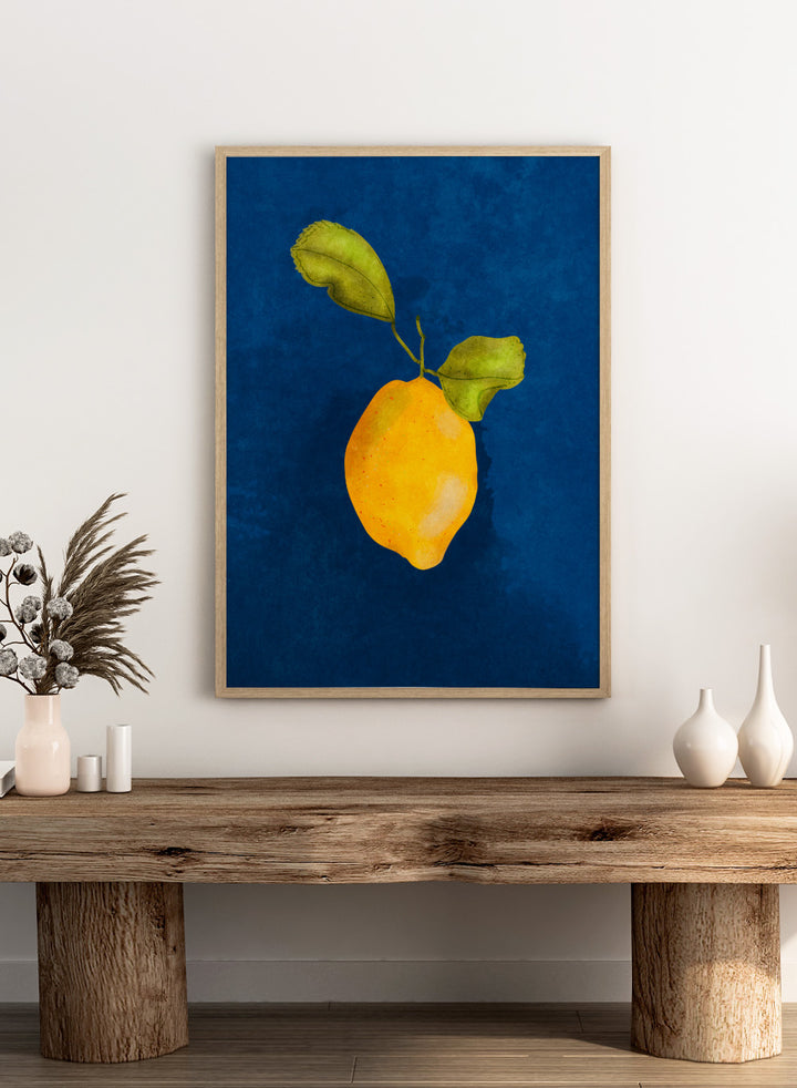 Just a Little Lemon by Raissa Oltmanns is a modern lemon art print featuring a bold yellow citrus still life on deep blue wall poster design.