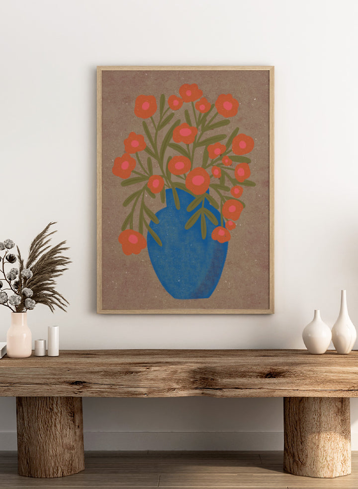 A stylized floral artwork showing orange flowers with pink centers and green stems arranged in a blue vase against a textured tan background. Shop Rustic Orange Floral Vase by Nikita Jariwala, a modern floral wall art print poster featuring a blue vase, orange flowers, and bold botanical style.