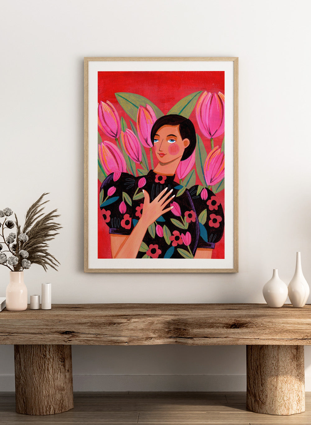 Illustration of a woman with floral dress and pink tulips on a red background. Woman portrait art print surrounded by pink tulips on a red background by Caroline Bonne Müller. Colorful floral illustration wall poster, officially licensed.