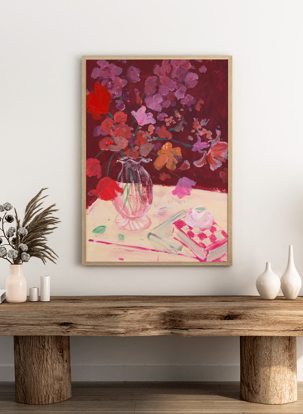 Colorful still life painting with flowers and a teacup on a table. Fall Bouquet by Katharina Puritscher art print featuring expressive floral still life, glass vase, coffee cup, book, and brushstrokes. Officially licensed wall poster.