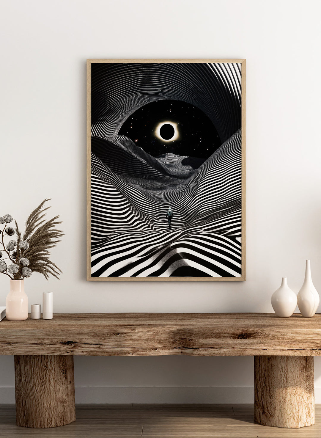 Black and white abstract design with a person standing in a tunnel-like pattern, featuring a celestial body in the center. New Adventures In Foreign Lands by Taudalpoi astronaut eclipse art print with black and white striped landscape and cosmic sky surreal poster.
