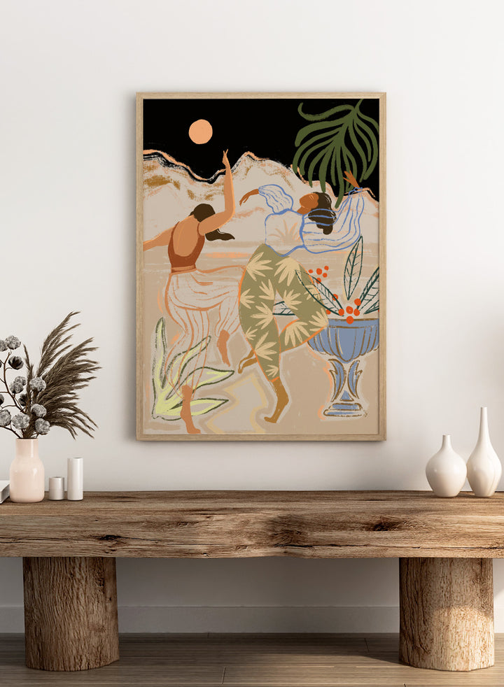Artistic depiction of two figures dancing with plants and a vase in the background. Moonlight Dance by Arty Guava is a modern illustration art print featuring dancing women, moon imagery, floral elements, and contemporary wall art design.