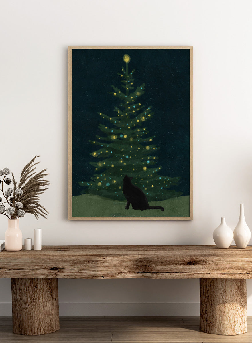 Shop Christmas Wishes by Katie O’Shea, a charming black cat Christmas wall art print poster featuring a glowing tree, festive lights, and deep green tones.