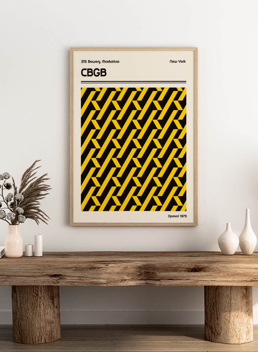 A vintage-style poster or print featuring a bold black and yellow geometric pattern in the center, with the text &