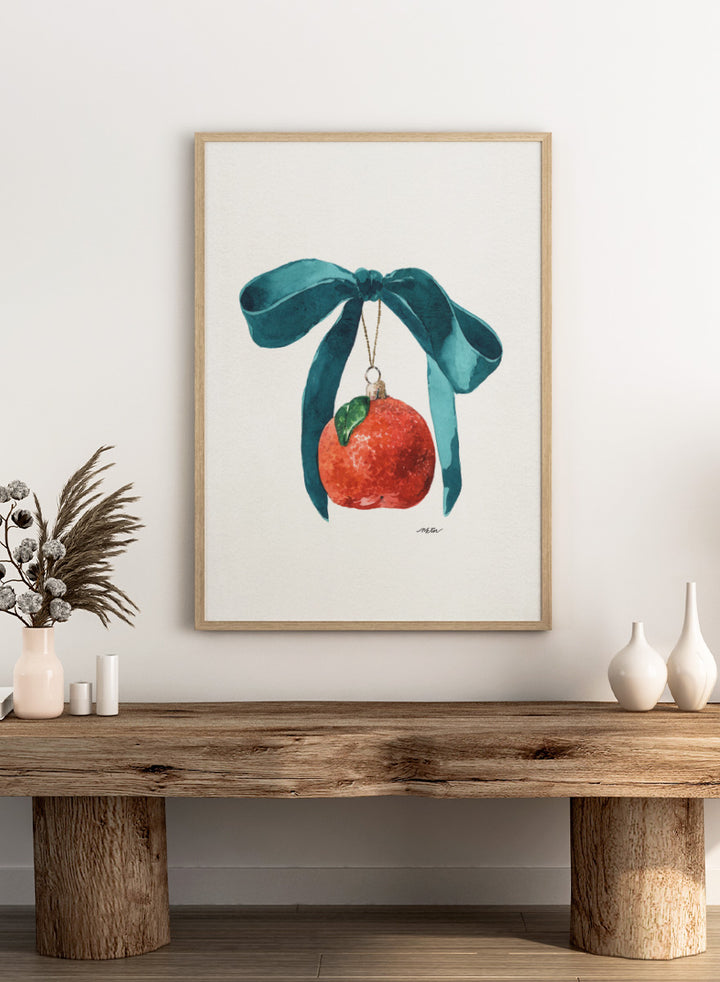 Shop Festive Tangerine Ornament by NKTN, a playful Christmas wall art print poster featuring a bright tangerine, oversized teal bow, and watercolor holiday style.