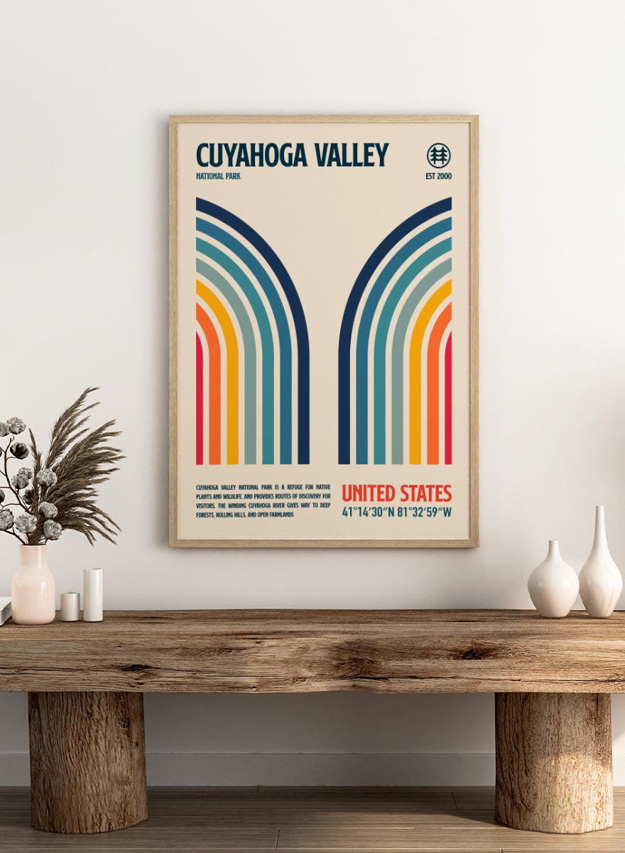 A retro-style poster for Cuyahoga Valley National Park featuring symmetrical rainbow arches in blue, teal, green, yellow, orange, and red on a cream background, with text reading &