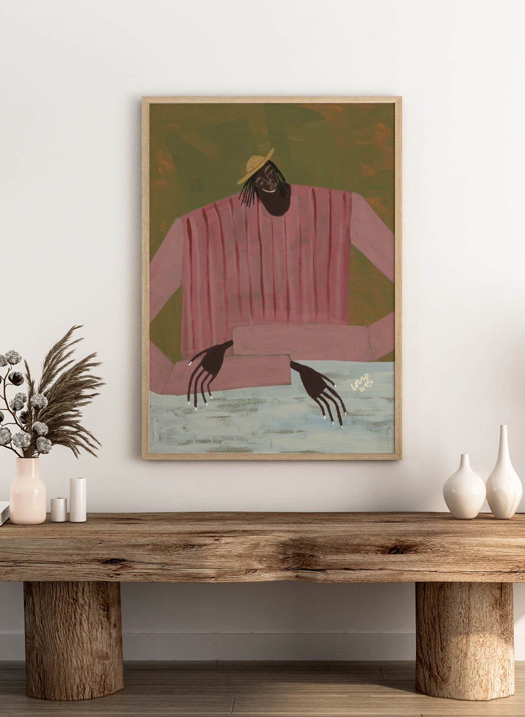 Artistic depiction of a person wearing a pink shirt and straw hat on a textured background. For Now I Don’t Know by Studio IMO (Ibi Meier-Oruitemeka) is a modern figurative art print with a seated figure and contemporary portrait wall poster design.