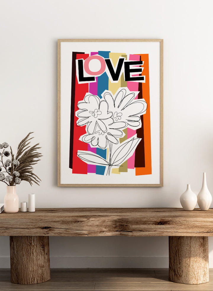 Colorful abstract design with flowers and the word 'LOVE' on a striped background. Scribble Flower by Frances Collett art print featuring a hand-drawn flower over bold colorful stripes with the word LOVE. Officially licensed wall poster with framing option.