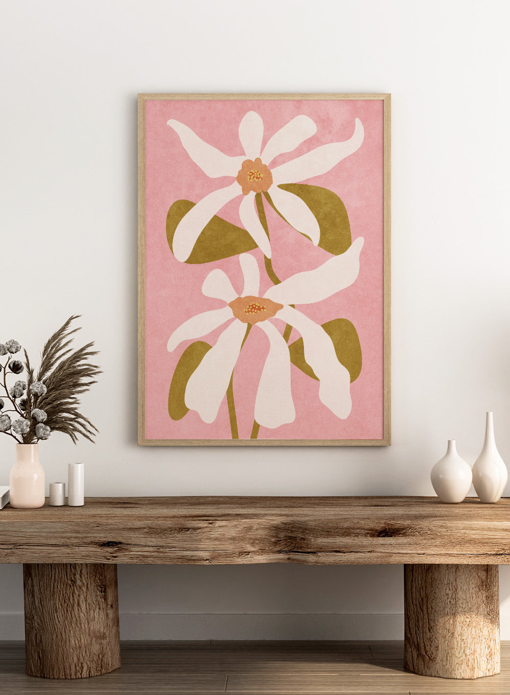 Two white flowers with green stems on a pink background. Abstract Flowers I by Raissa Oltmanns is a modern floral art print featuring white blooms on pink in contemporary botanical wall poster style.