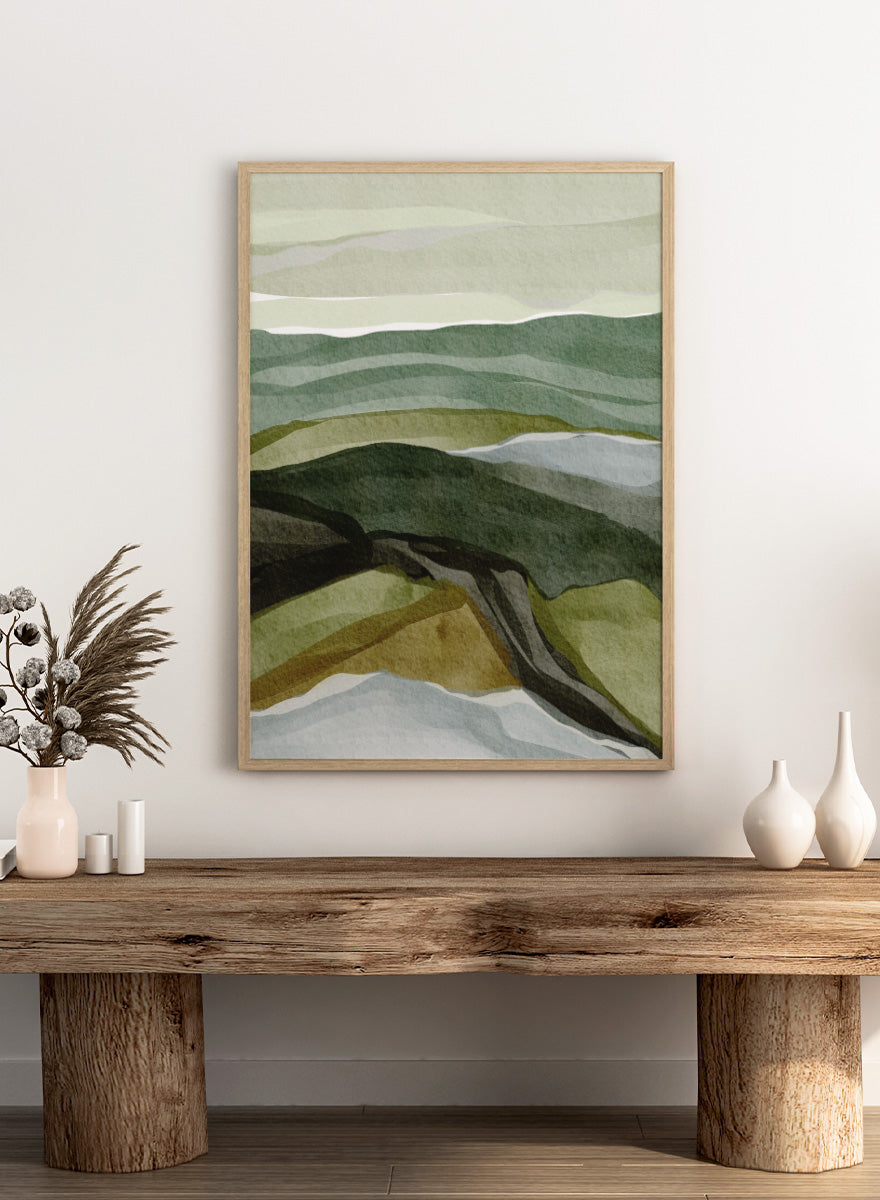 Shop Serene Green Landscape by Nikita Jariwala, a modern abstract landscape art print featuring layered hills, rolling countryside, and soft green, olive, gray, and blue tones.