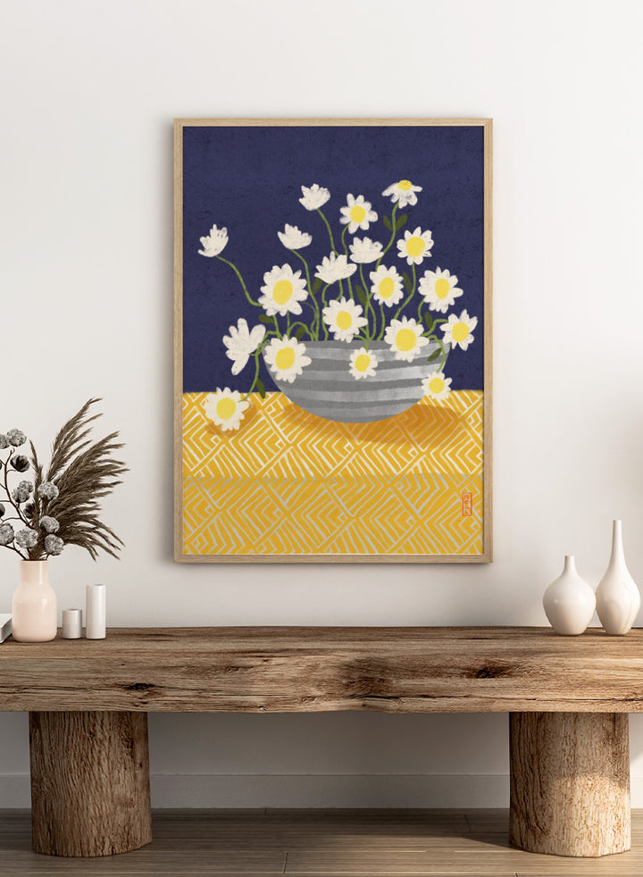 A stylized floral still life artwork showing white daisies with yellow centers in a gray striped bowl, set against a dark navy background and a yellow patterned surface. Shop Cheerful Daisy Arrangement by Dirkie Nell, a colorful floral art print featuring white daisies, a striped vase, navy blue background, and mustard yellow pattern.
