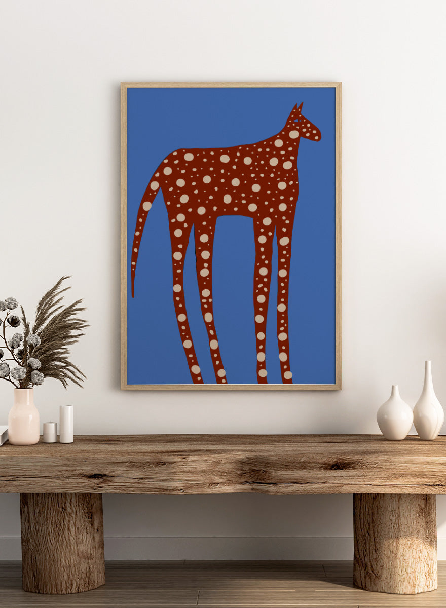 Spotted Long Legged Horse by The Art Concept playful animal art print featuring an elongated spotted horse against a bold blue background.