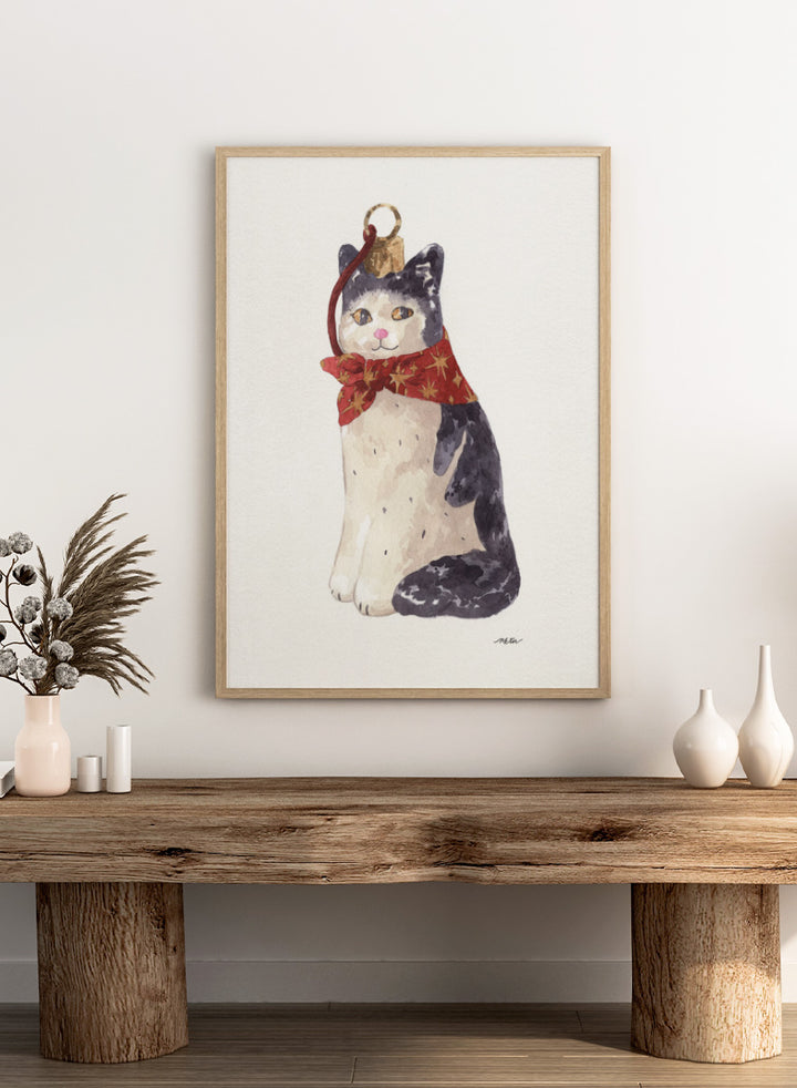 Shop Christmas Cat Ornament by NKTN, a festive cat animal wall art print poster featuring a black-and-white cat in a red star scarf with watercolor detail.