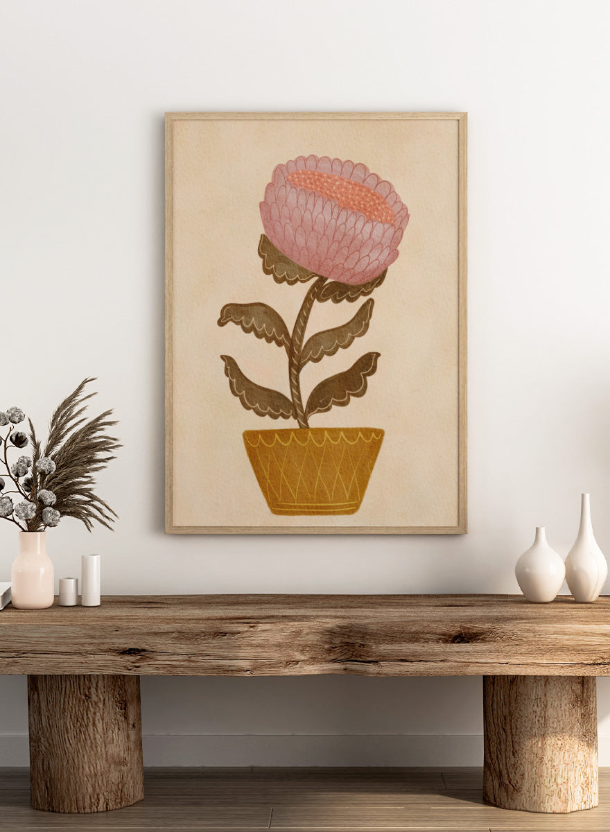 Shop Rustic Potted Flower by Nikita Jariwala, a floral wall art print poster featuring an oversized pink flower, mustard pot, folk art details, and earthy tones.