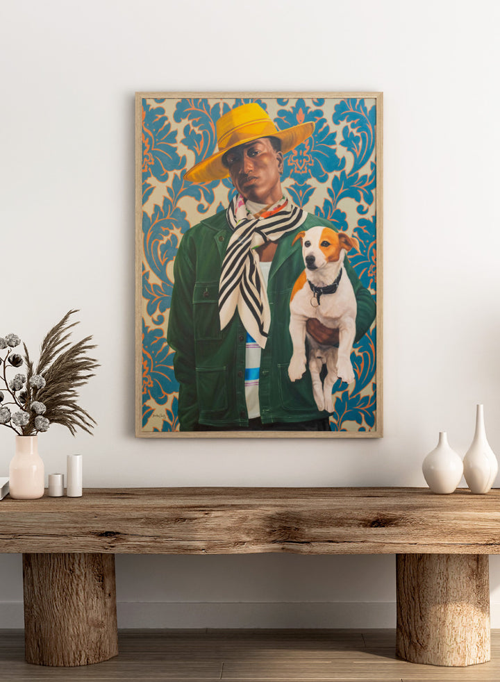 A stylized portrait painting of a person wearing a wide yellow hat, green jacket, and striped scarf, holding a white and tan dog against a blue and beige damask-patterned background. Shop Stylish Man and Dog by Damilare Jamiu, a contemporary figurative wall art print featuring a stylish man, small dog, bold fashion, and rich green and blue tones.
