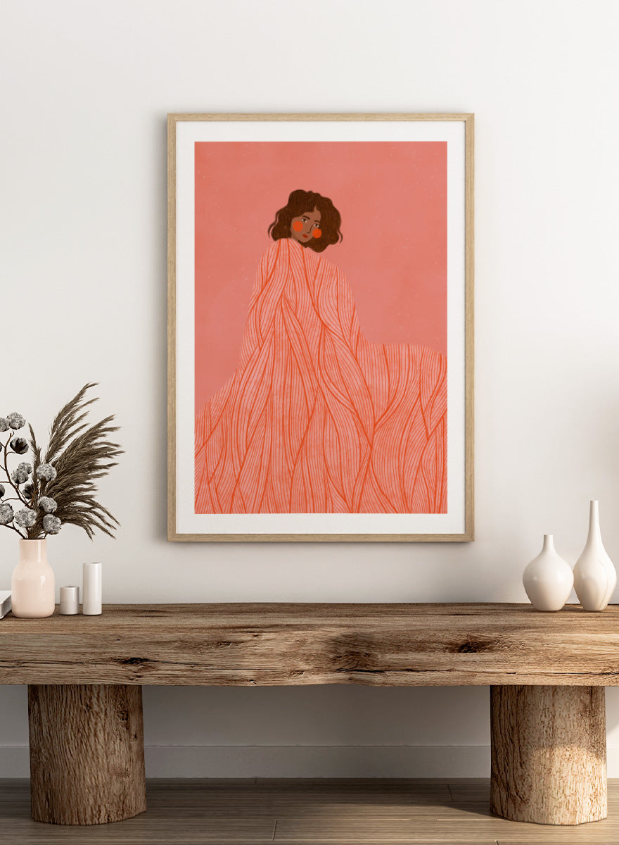 An art print featuring an illustration of a woman with dark curly hair wrapped in a flowing coral-orange patterned dress against a solid pink background. Coral Woman Dreaming by Bea Müller portrait art print featuring a woman wrapped in a flowing coral dress with fine red lines and modern graphic detail.
