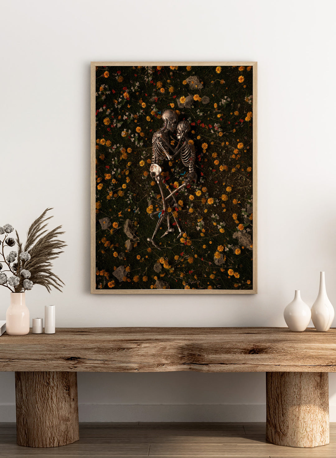 Skeletons In Love by Nicebleed is a surreal skeleton couple art print featuring intertwined skeletons in a floral field, modern aesthetic wall poster.